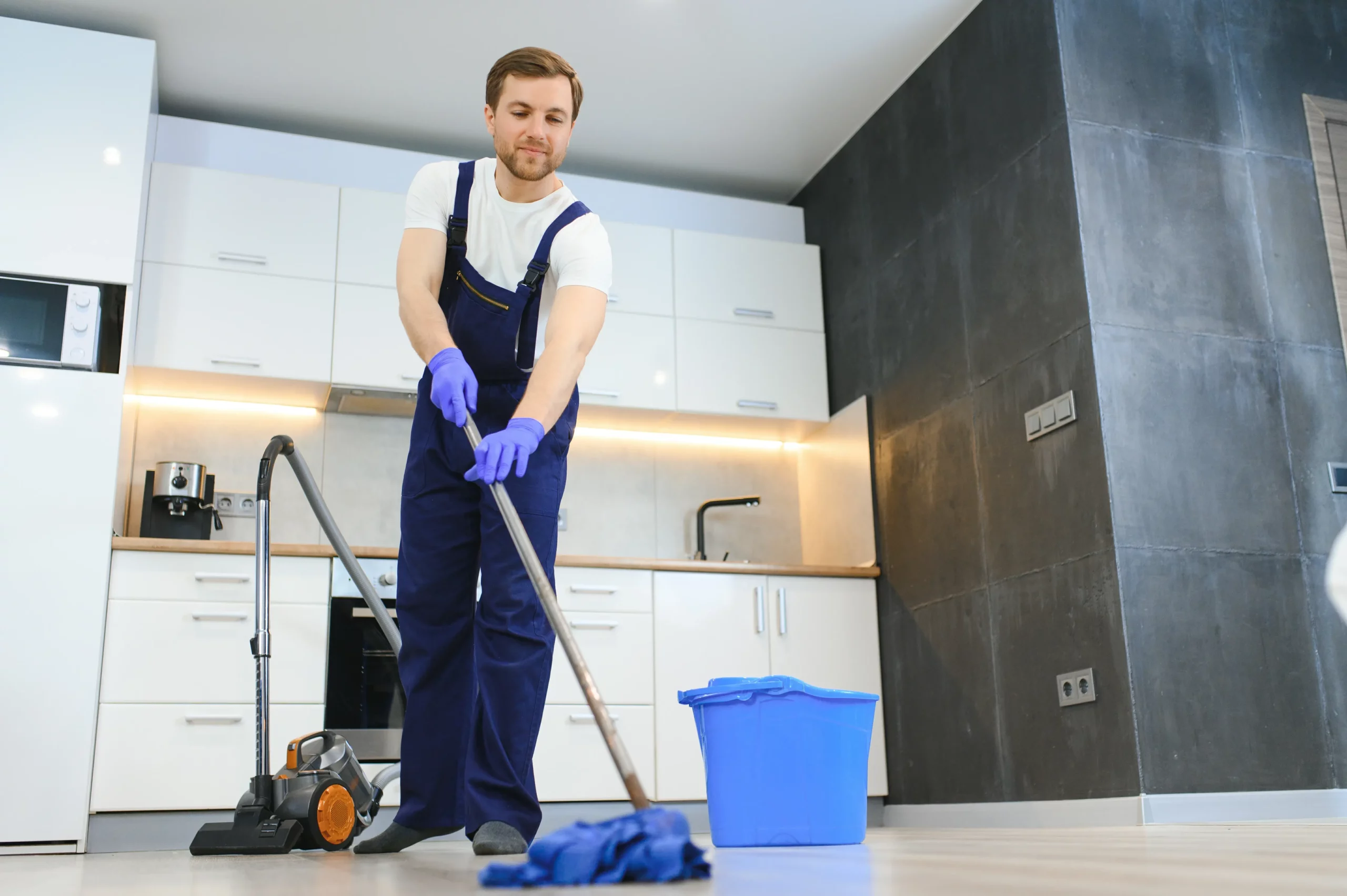 professional cleaner in blue uniform washing floor 2024 01 04 21 14 22 utc scaled
